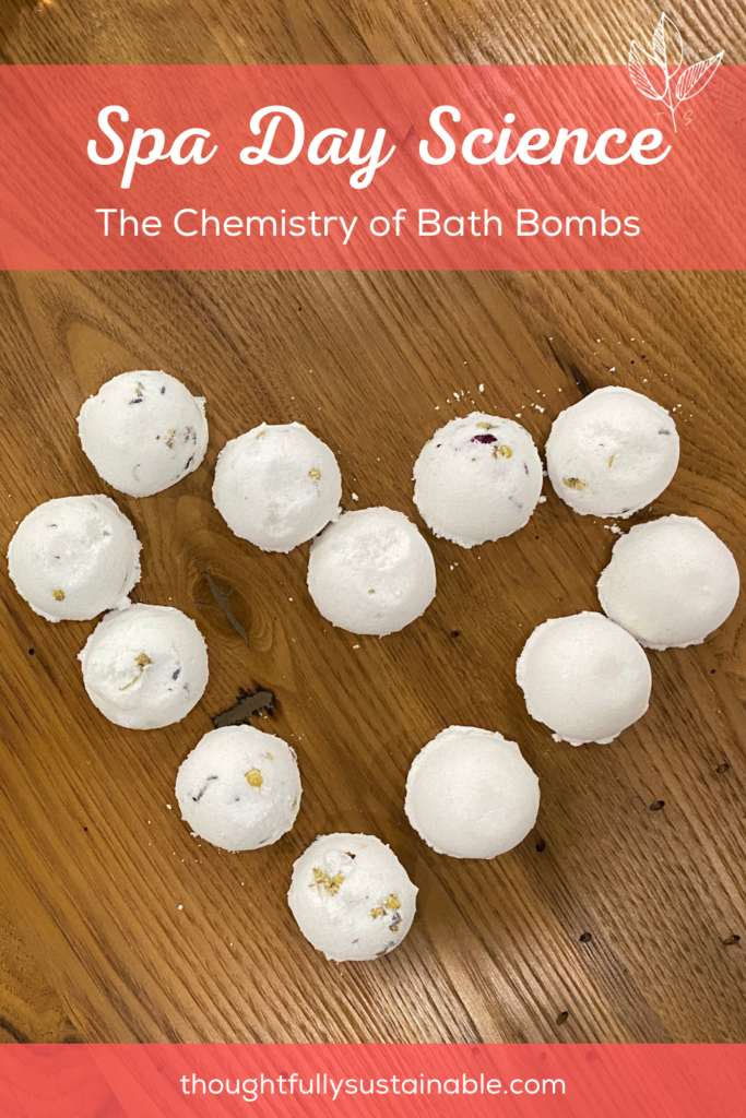 bath bombs are arranged in a heart shape on top of a wooden table