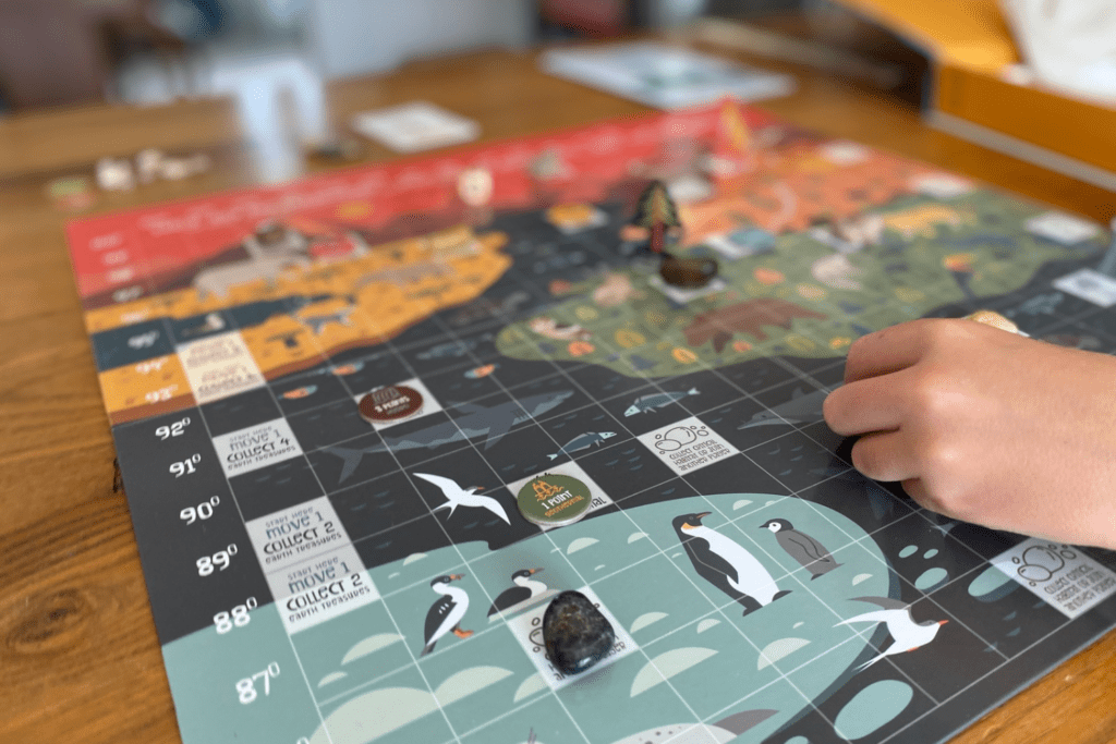 Earth matters board game sits on a wooden table